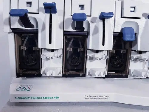 Affymetrix genechip fluidics station 450 in white and blue with black internal components for precise fluid handling