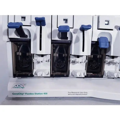 Affymetrix genechip fluidics station 450 in white and blue with black internal components for precise fluid handling