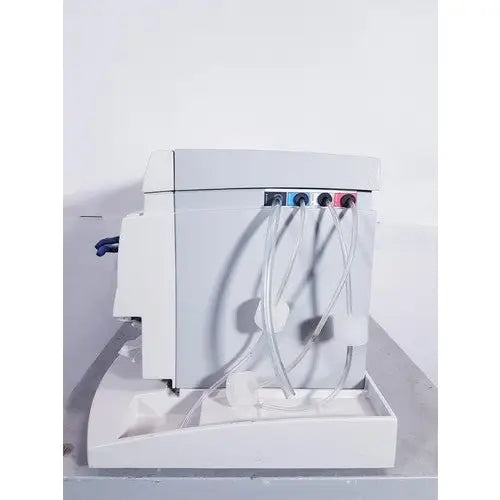 White plastic laboratory pump with three colored connectors and clear tubing for affymetrix genechip fluidics station 450