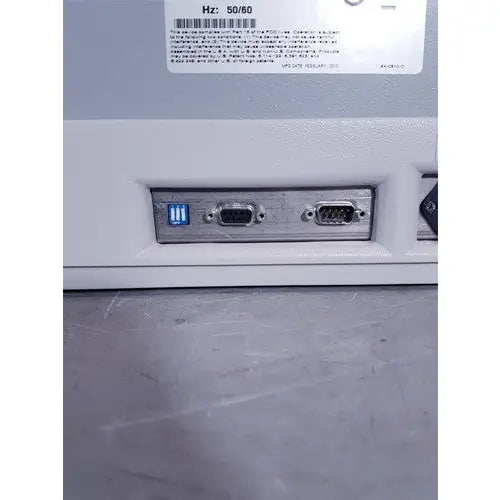 White plastic affymetrix genechip fluidics station 450 back with three ports including glowing blue usb and two black vga connectors