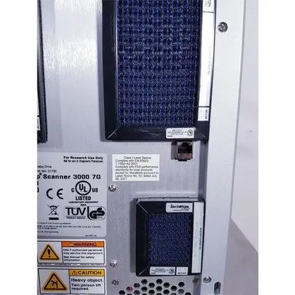Blue mesh filter panel on the front side of silver affymetrix genechip scanner 3000 for reuse medical applications