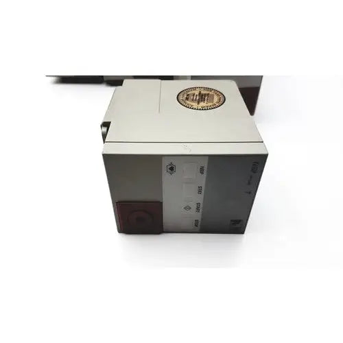 Gray rectangular agilent hp philips m1008b nbp patient monitor module with gold emblem and side labels visible