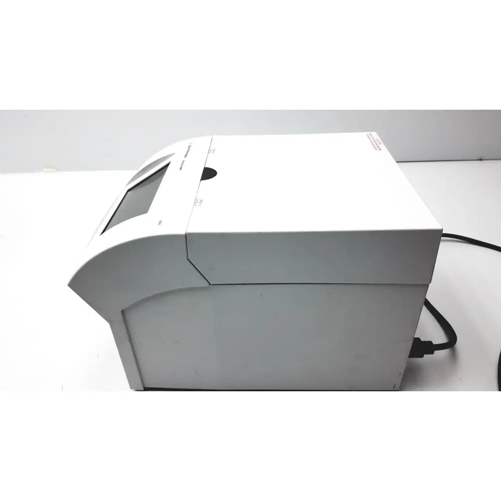 White plastic agilent surecycler 8800 touch screen thermal cycler with small screen and black power cord visible