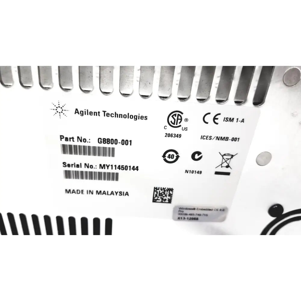White label with black text and symbols on the back of an agilent surecycler 8800 touch screen thermal cycler g8800-001