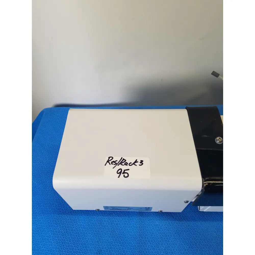 White rectangular agilent technologies 810 peristaltic pump with black side panel and handwritten reuse medical label rack 3 95