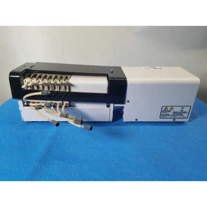 White and black agilent technologies 810 peristaltic pump with beige cables and connectors for reuse medical applications