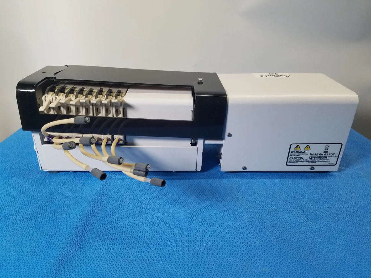 White and black agilent technologies 810 peristaltic pump with beige cables and connectors for reuse medical applications
