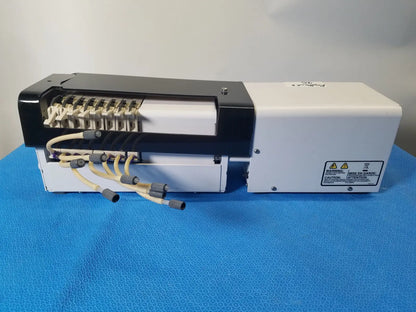 White and black agilent technologies 810 peristaltic pump with beige cables and connectors for reuse medical applications