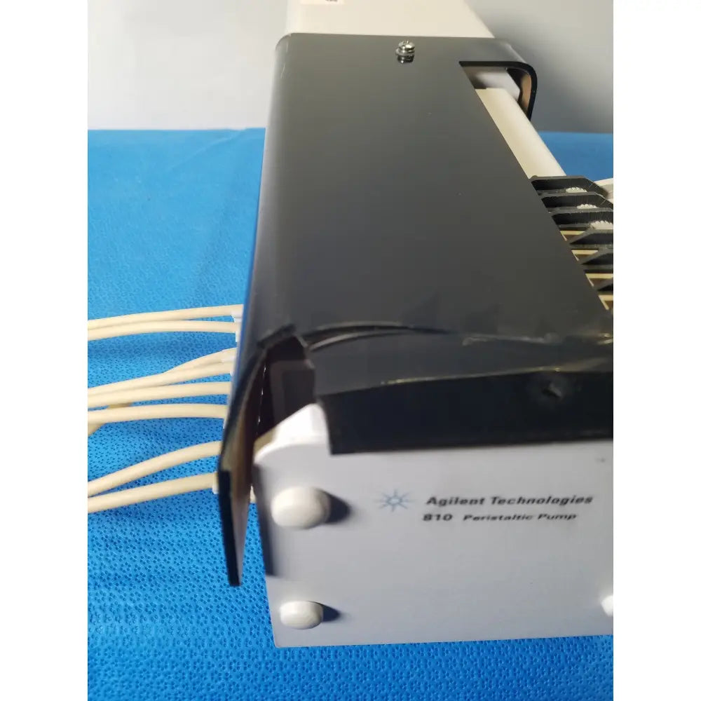 Agilent technologies 810 peristaltic pump in black and white with sleek rectangular design for medical reuse applications