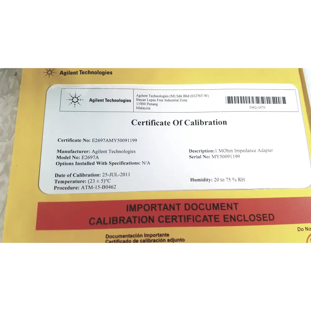 White paper certificate with black text issued by agilent technologies for e2697a 1 mohm impedance adapter