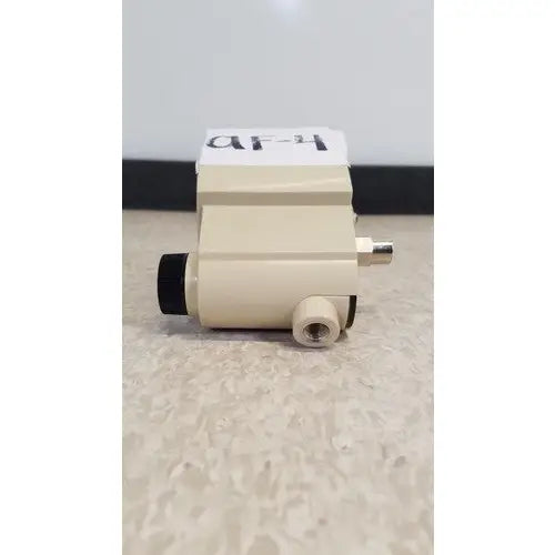 Beige industrial airco vacuum regulator pressure sensor with black and brass fittings for precise vacuum control