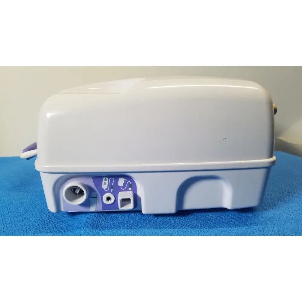 White and purple portable nebulizer with compact rounded design for airflo bathing cushion air compressor use