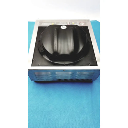 Black plastic dome-shaped lid with emblem on metallic frame of aladdin temp-rite heat on demand advantage plate heater
