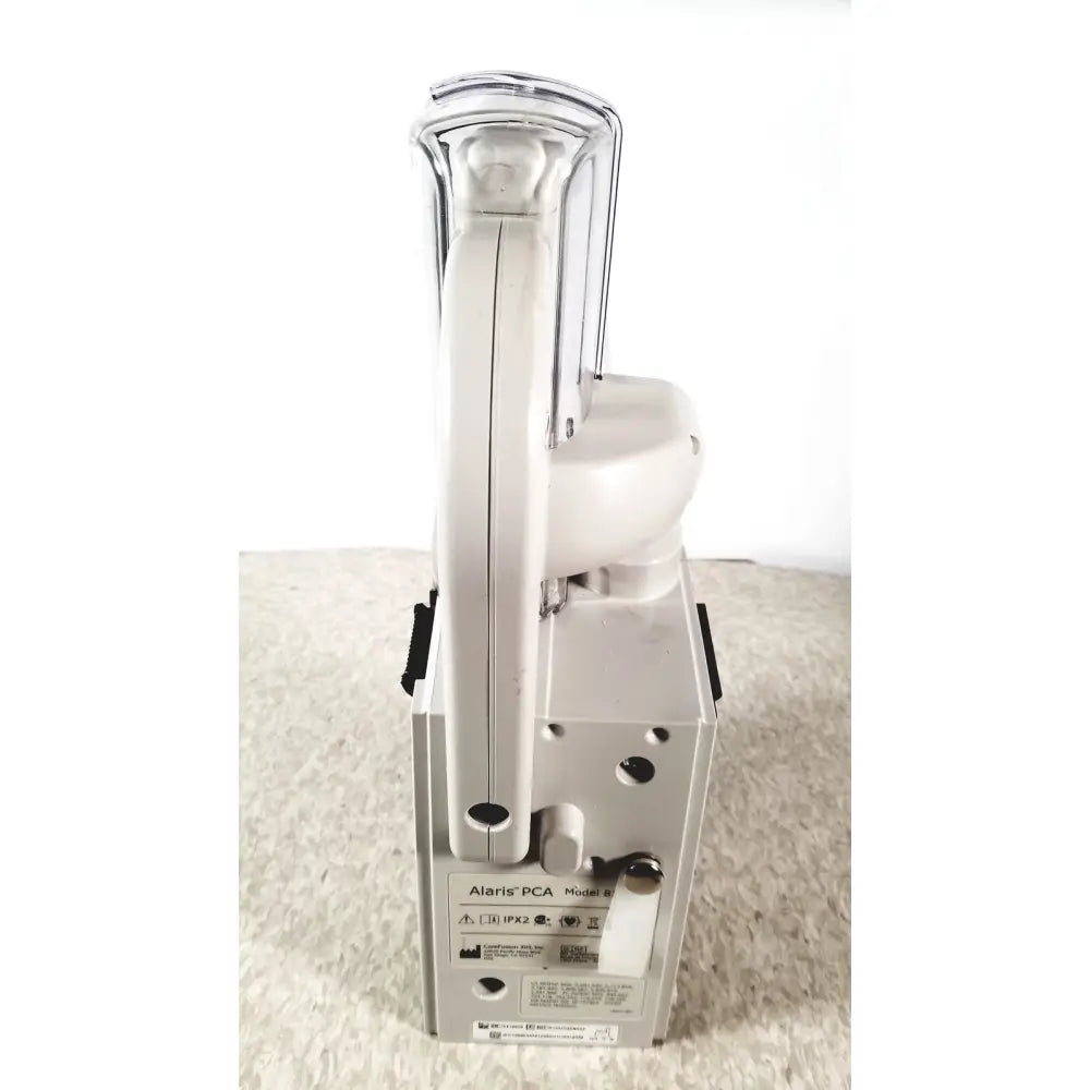 White alaris pca model 9 portable medical device with clear plastic handle and metallic accents for infusion therapy