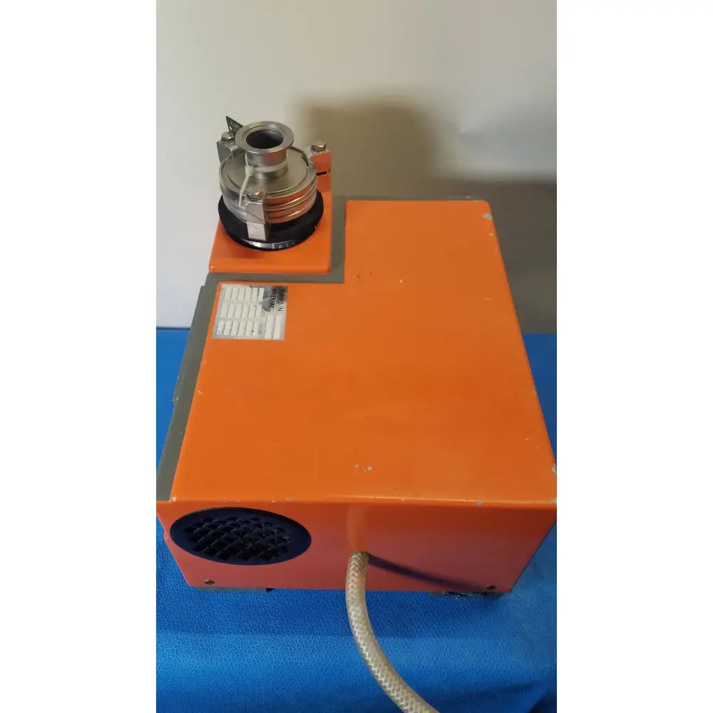 Orange rectangular industrial vacuum pump station alcatel drytel 31 with metallic cylindrical attachment and coiled hose