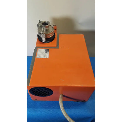 Orange rectangular industrial vacuum pump station alcatel drytel 31 with metallic cylindrical attachment and coiled hose