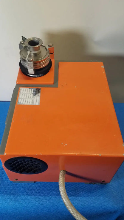 Orange rectangular industrial vacuum pump station alcatel drytel 31 with metallic cylindrical attachment and coiled hose