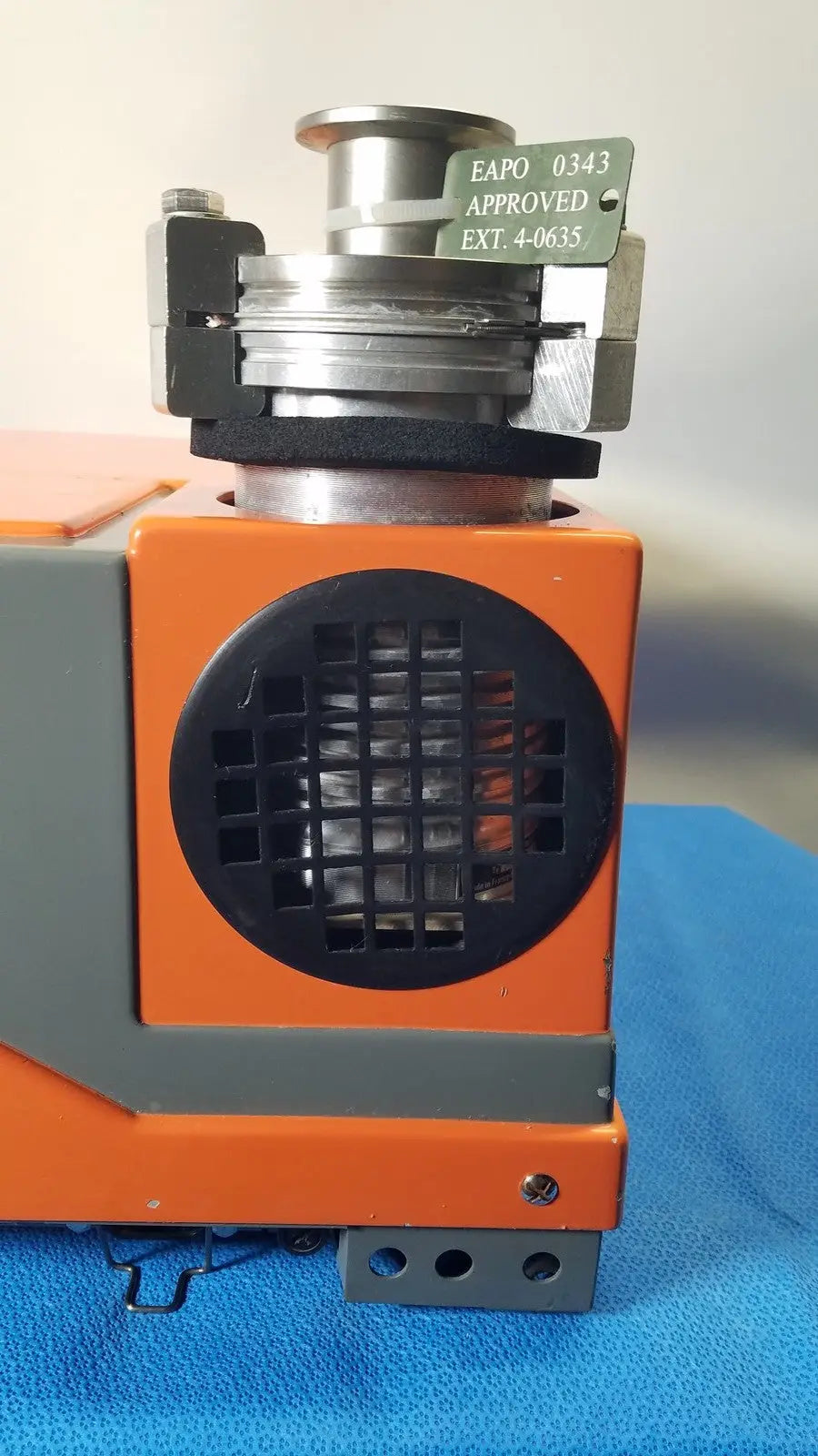 Alcatel drytel 31 vacuum pump station with orange and gray industrial vacuum pump and metallic top assembly