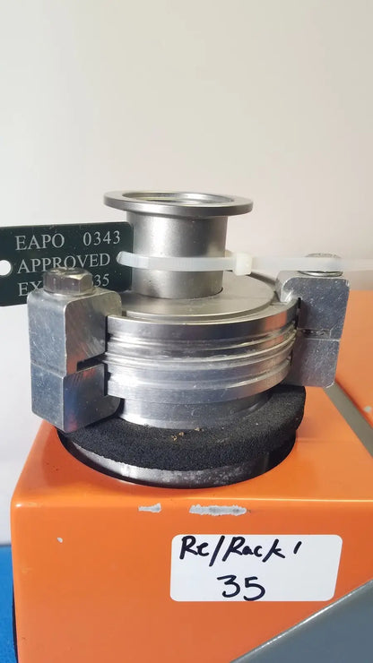 Silver metallic flange coupling with threaded ends and black rubber gasket secured by clamps for alcatel drytel vacuum pump station