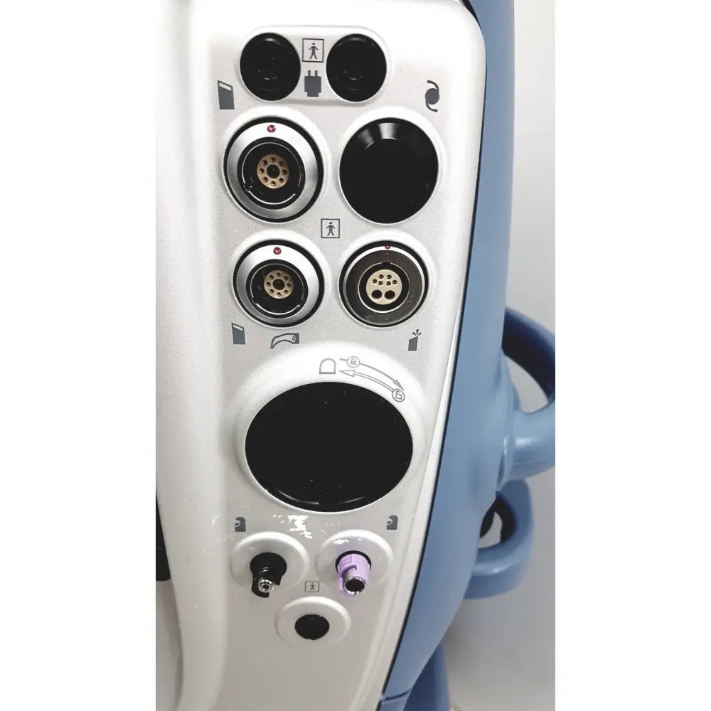 White and blue alcon infiniti vision phacoemulsification surgical unit with circular ports and silver metallic accents