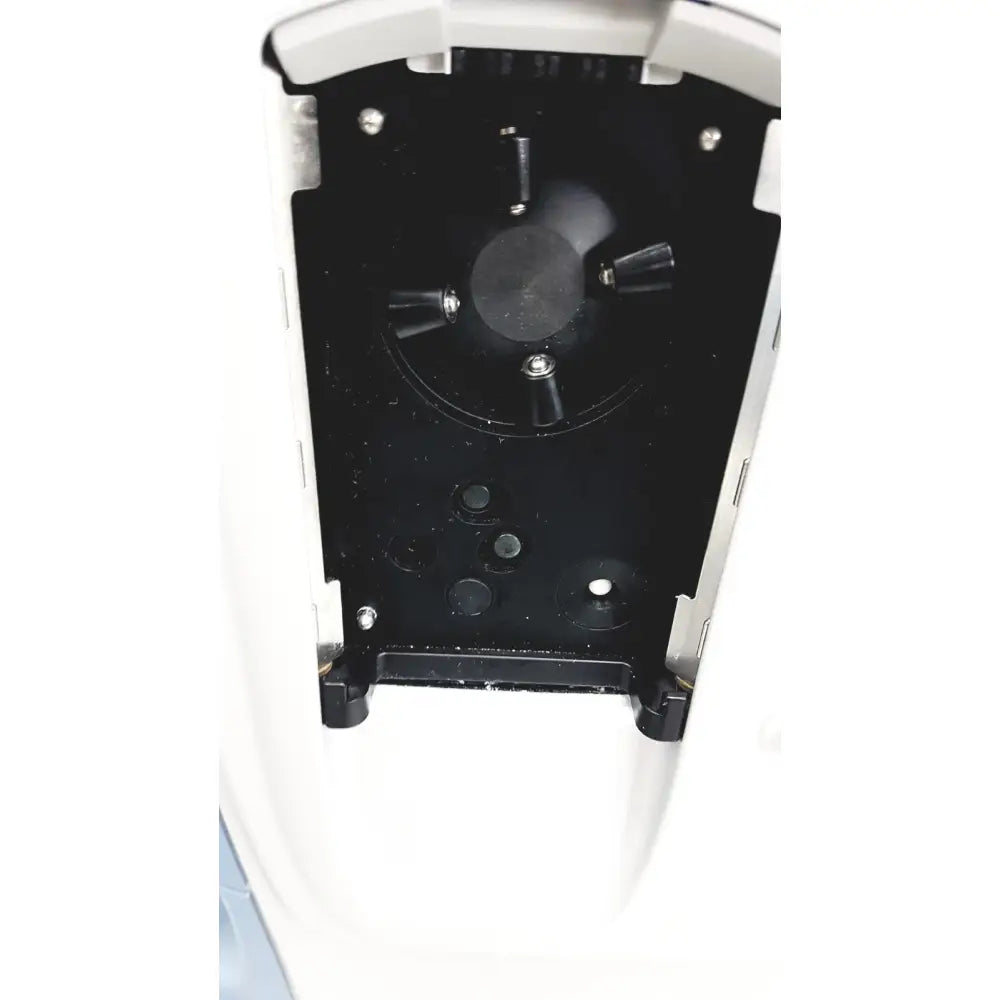 Black plastic mounting plate with four cylindrical protrusions and silver screws in white housing for alcon infiniti vision system