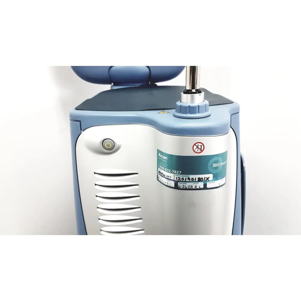 Blue and silver alcon infiniti vision phacoemulsification surgical unit with rounded top panel and side ventilation slits
