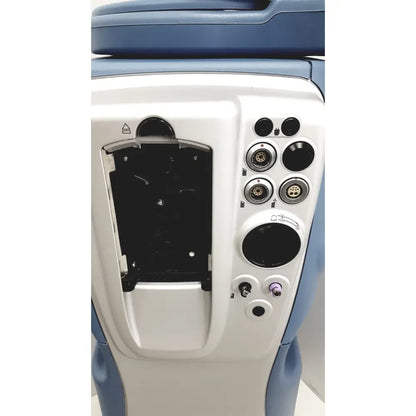 Blue and white medical device with multiple circular ports and purple connector on the back of alcon infiniti vision system model 210-0000-511