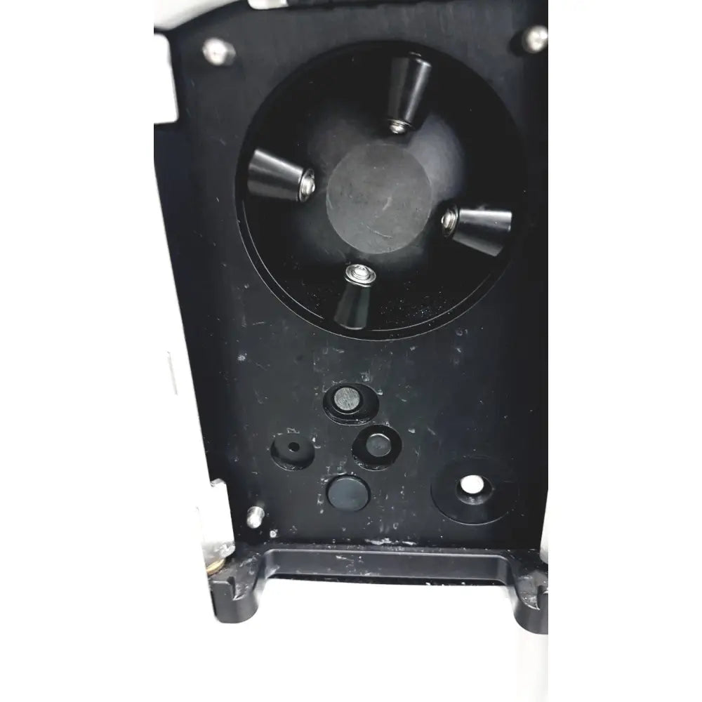 Black plastic reuse medical device with circular hub and four conical protrusions from alcon infiniti vision system model 210-0000-511