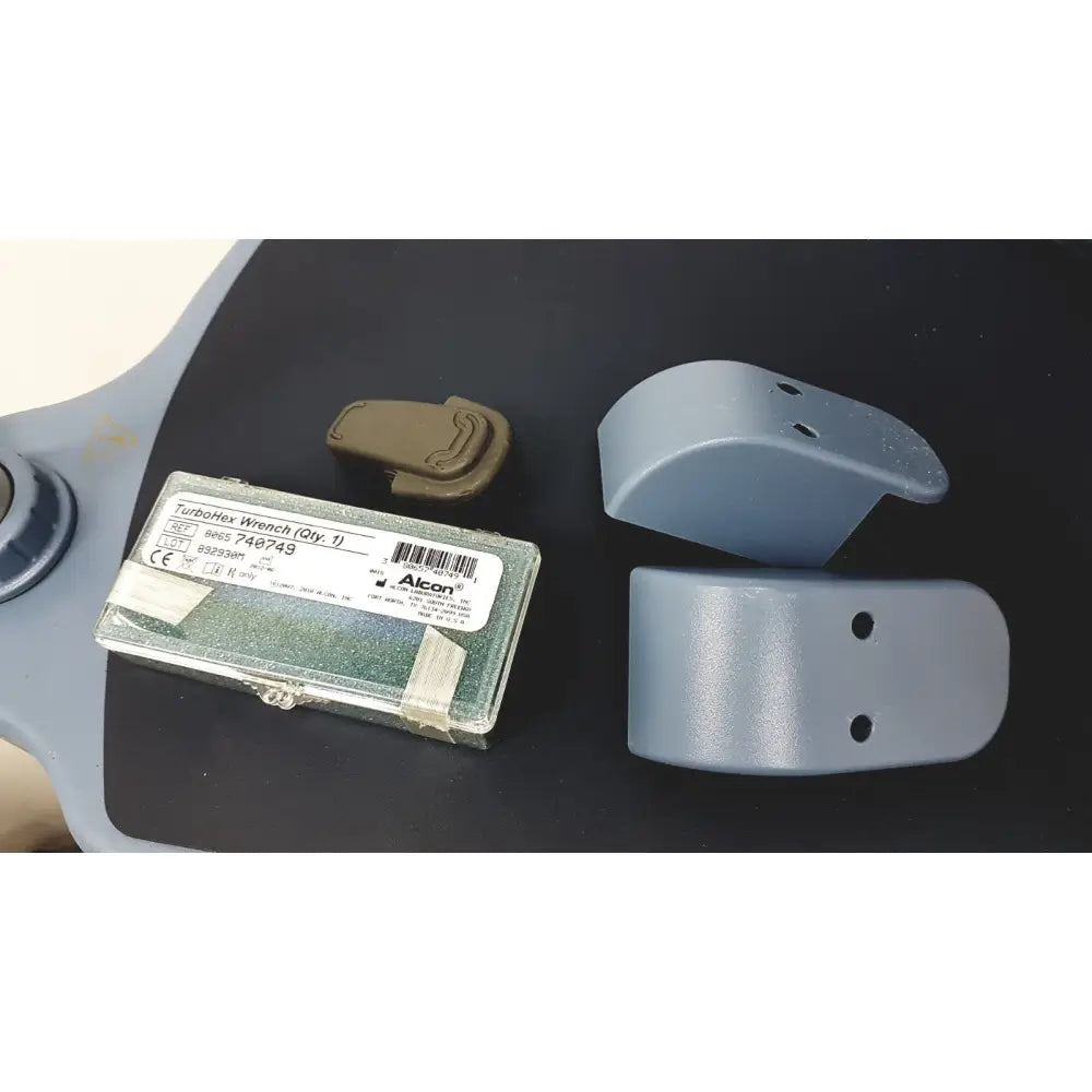Gray plastic turbohex wrench with brown attachment in clear case for alcon infiniti vision system model 210-0000-511