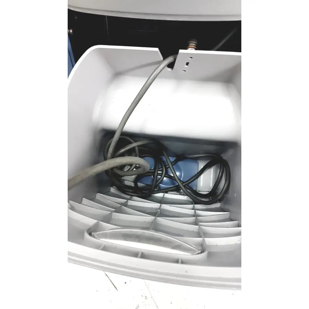 White plastic interior housing with coiled black and gray cables of alcon infiniti vision system model 210-0000-511 back side for reuse medical use