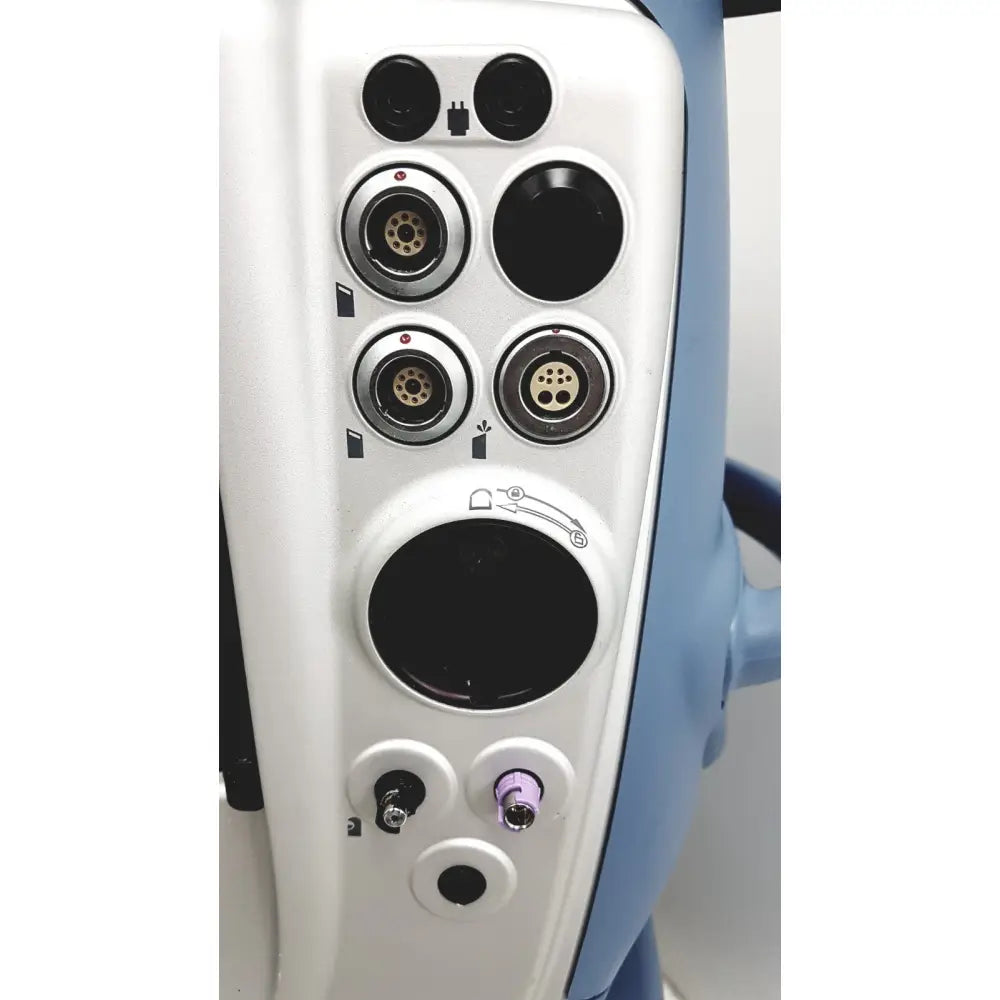 White medical device panel with multiple black silver circular ports purple port and blue handle on alcon infiniti vision system back side