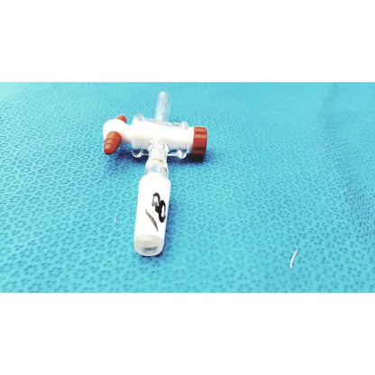 Clear plastic iv catheter with white and red caps paired with aldrich glass 14/20 ptfe bore septum inlet flow control adapter