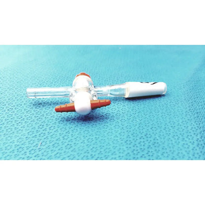 Clear plastic Aldrich Glass septum inlet flow control adapter with orange and white connectors and central valve mechanism