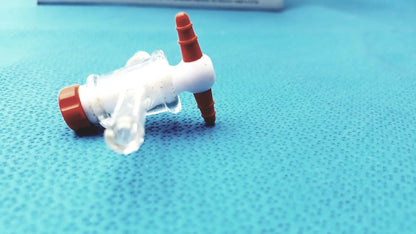 Clear plastic aldrich glass 14/20 septum inlet flow control adapter with red caps and threaded ports for inlet flow control