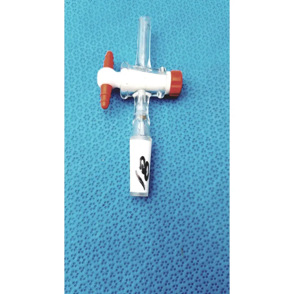 Aldrich glass septum inlet flow control adapter with clear tubing, white body, orange caps, and handwritten label