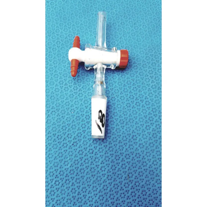 Aldrich glass septum inlet flow control adapter with clear tubing, white body, orange caps, and handwritten label