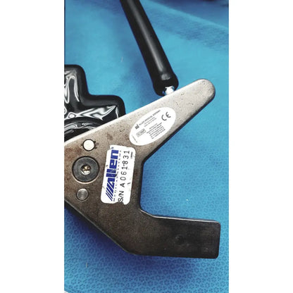 Black-handled metal clamping tool with serial label from allen medical yellofins elite lift-assist stirrups