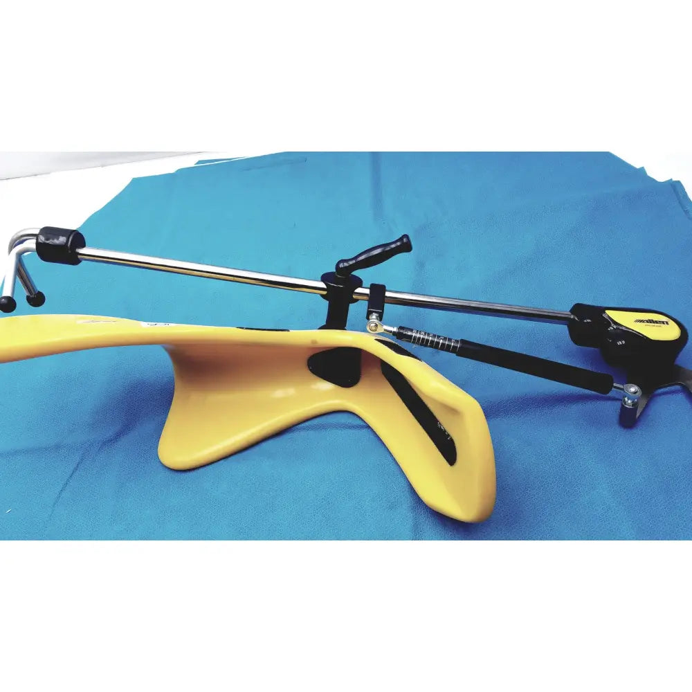Yellow plastic orthopedic neck brace with black metal adjustments and label from allen medical yellofins elite collection