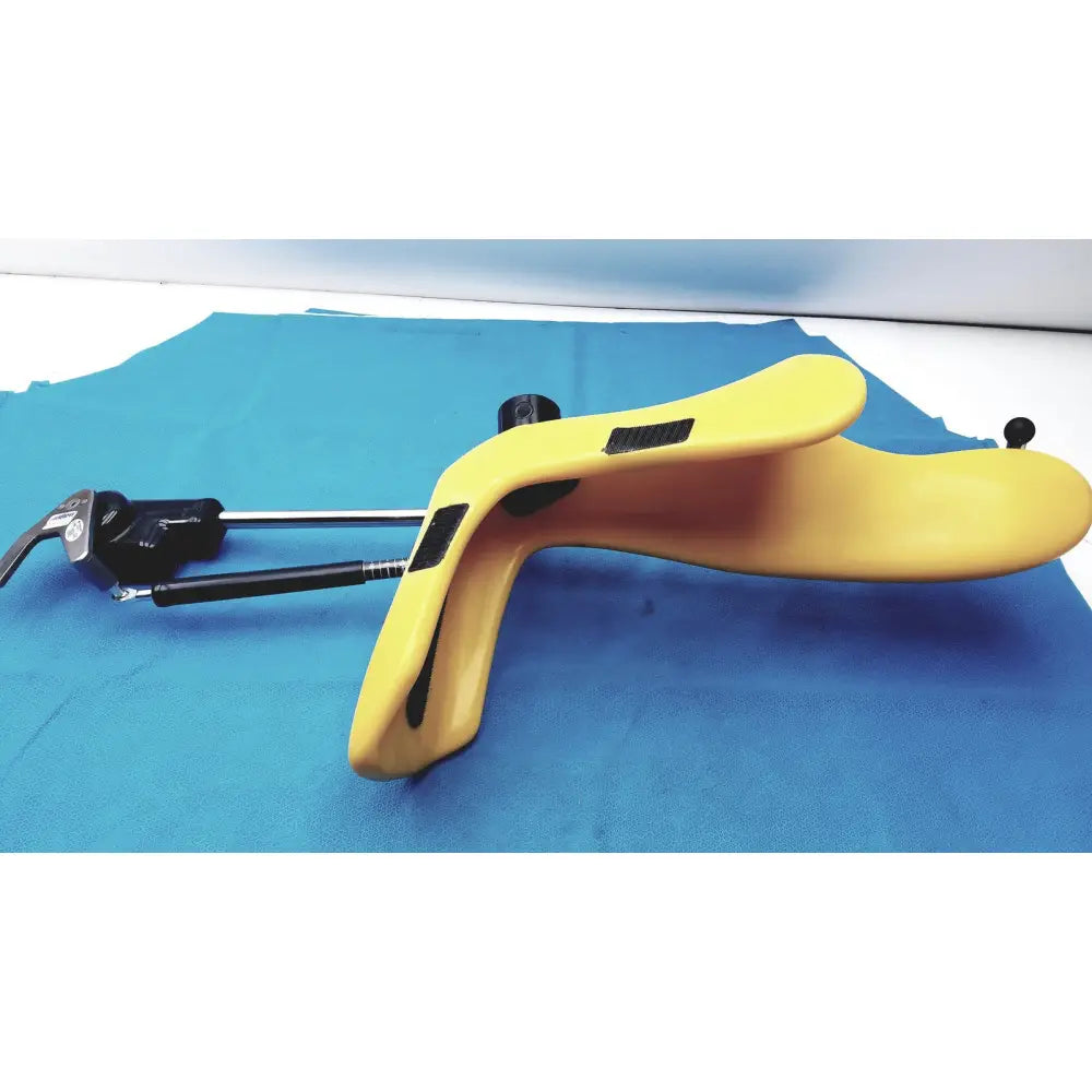 Yellow plastic medical speculum with black accents and metal handle from Allen Medical Yellofins Elite Lift-Assist Stirrups