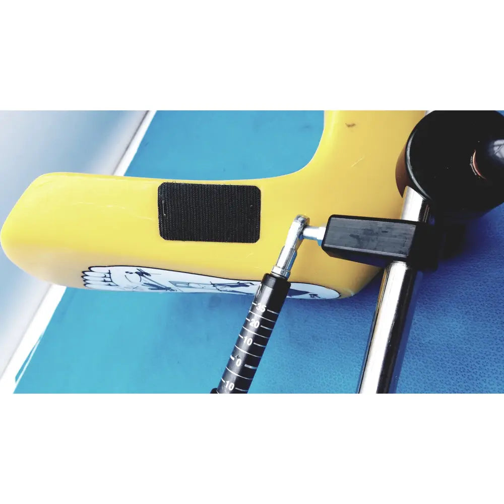 Yellow plastic surfboard leash with black velcro strap and white cartoon foot graphic for Allen Medical Yellofins Elite lift-assist stirrups
