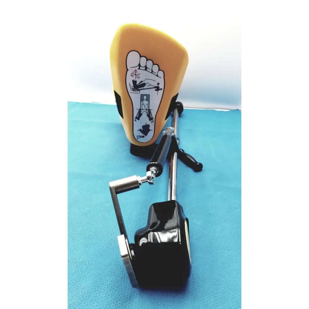 Yellow foot-shaped orthotic with black accents and lever system for foot exercises in allen medical yellofins elite stirrups