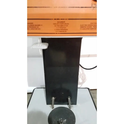 Black allied healthcare gomco 3040 aspirator with orange warning label and metallic handles for reuse medical applications
