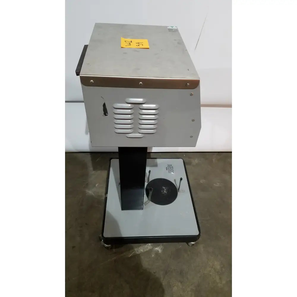 Industrial-grade silver metal allied healthcare gomco 3040 aspirator with black base and ventilation slats on side panel