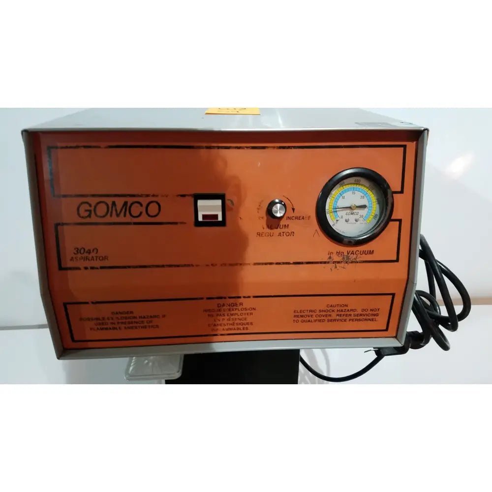 Orange allied healthcare gomco 3040 aspirator with pressure gauge and control knob for reuse medical applications