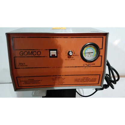 Orange allied healthcare gomco 3040 aspirator with pressure gauge and control knob for reuse medical applications