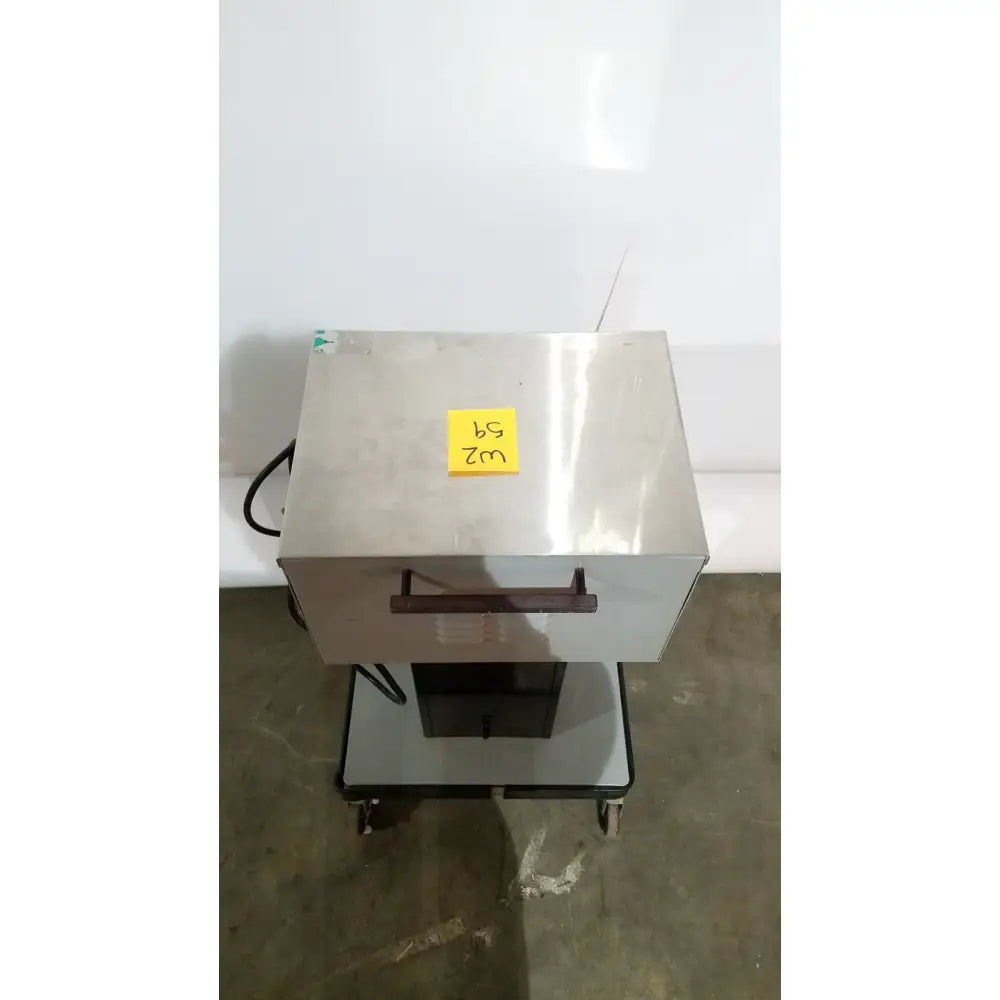 Stainless steel allied healthcare gomco 3040 aspirator industrial oven with black handle and wheels on matching cart for reuse medical use