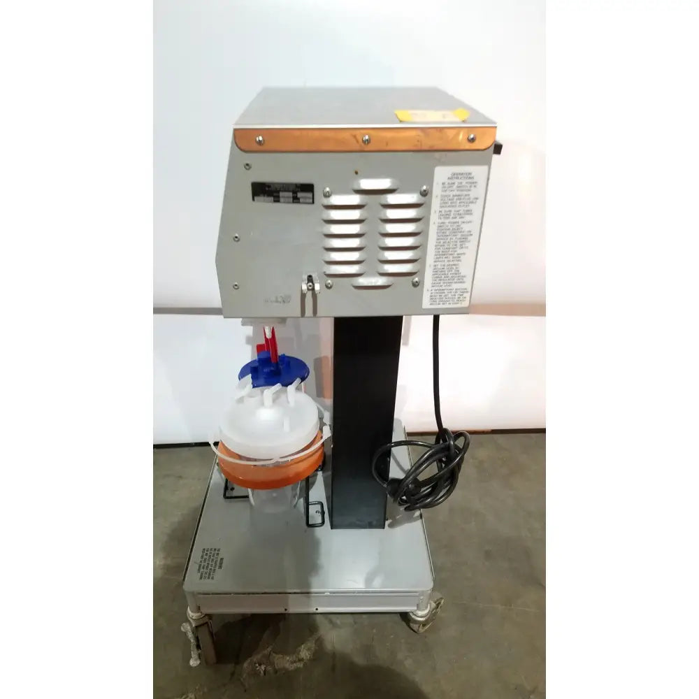 Silver industrial-grade laboratory centrifuge with wooden top and orange rotor assembly by allied healthcare gomco