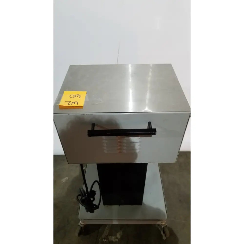 Stainless steel commercial-grade food warmer with black handle and yellow 60 label from allied healthcare gomco model 6037 aspirator