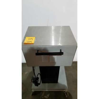 Stainless steel commercial-grade food warmer with black handle and yellow 60 label from allied healthcare gomco model 6037 aspirator