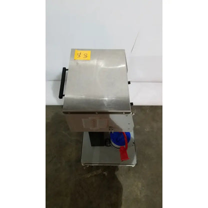 Stainless steel allied healthcare gomco model 6037 industrial food processor with black handle and blue container attached